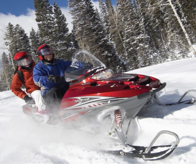 Snowmobiling people