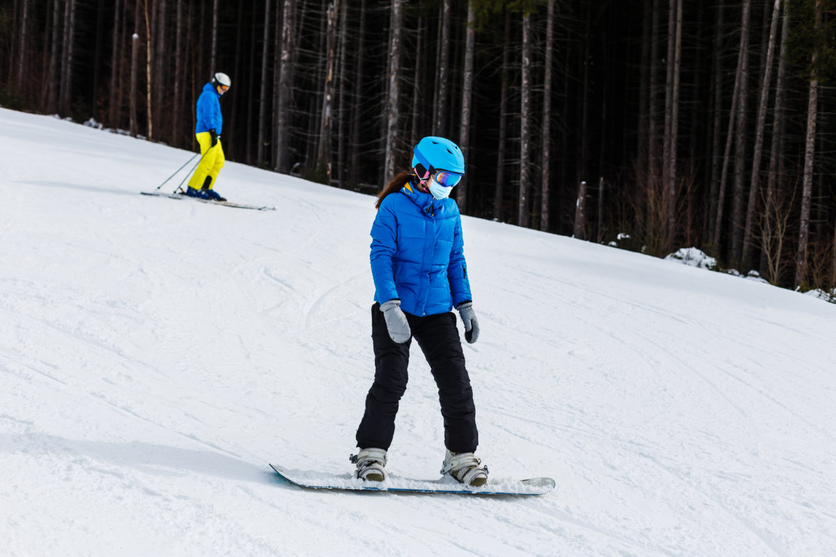 girl snowboarding at dry hill